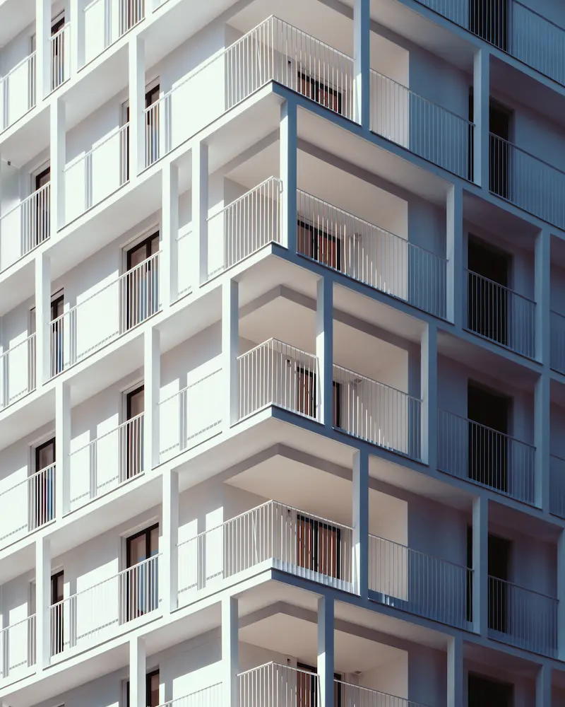 vertical-low-angle-shot-high-rise-white-concrete-building