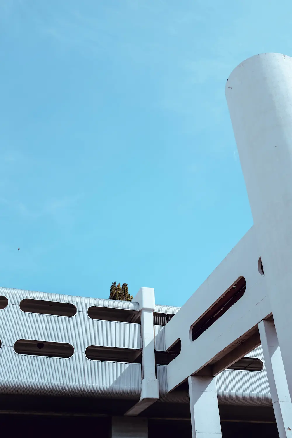 vertical-shot-exotic-white-building-blue-sky
